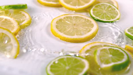 Lemon-slices-falling-into-water