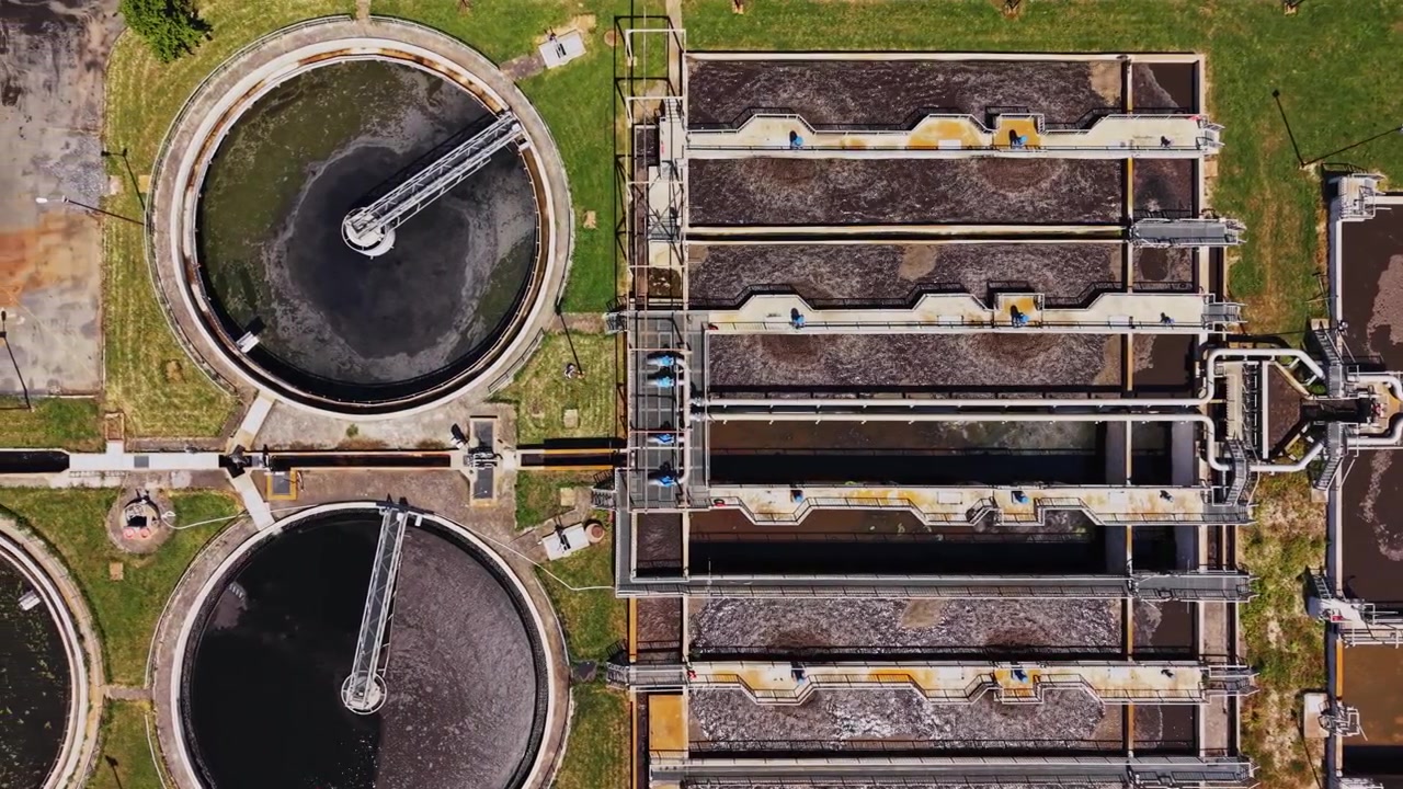 Water treatment facility shows large tanks and treatment processes at work