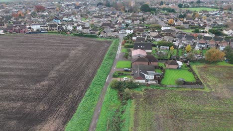 aerial view of a british village and surrounding fields
