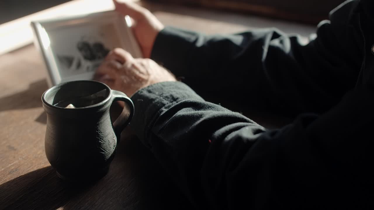 Man looking at an old photo