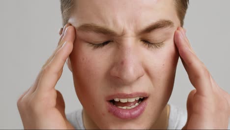 man experiencing a headache