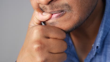 man biting his nails