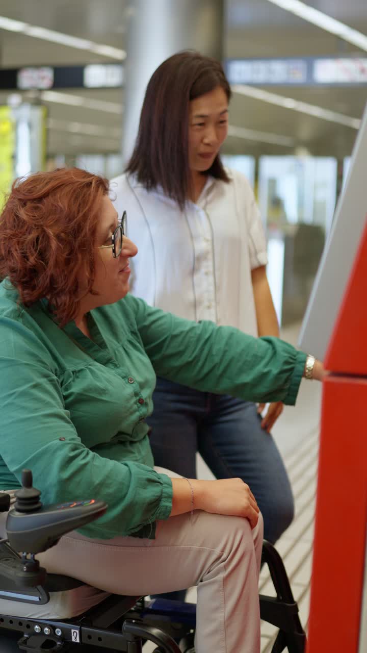 Woman using wheelchair at transport terminal