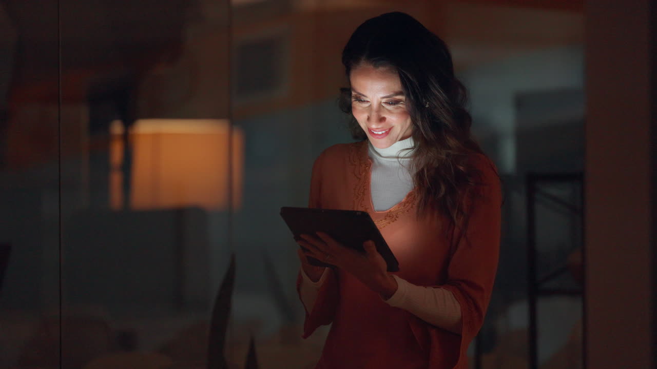 Woman Enjoying Tablet at Night