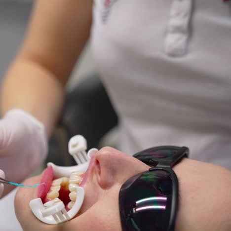 dentist check up teeth of young woman. woman at dentist having dental treatment at dentist office