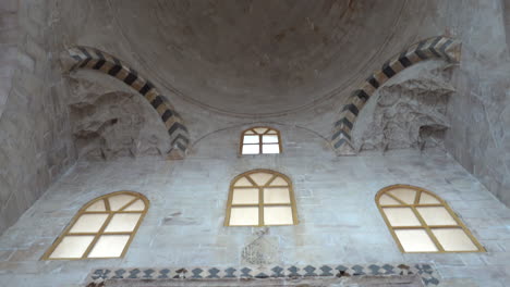 arabic inscriptions written with extraordinary stonework on the door frame of zinciriye madrasa and a view of the dome