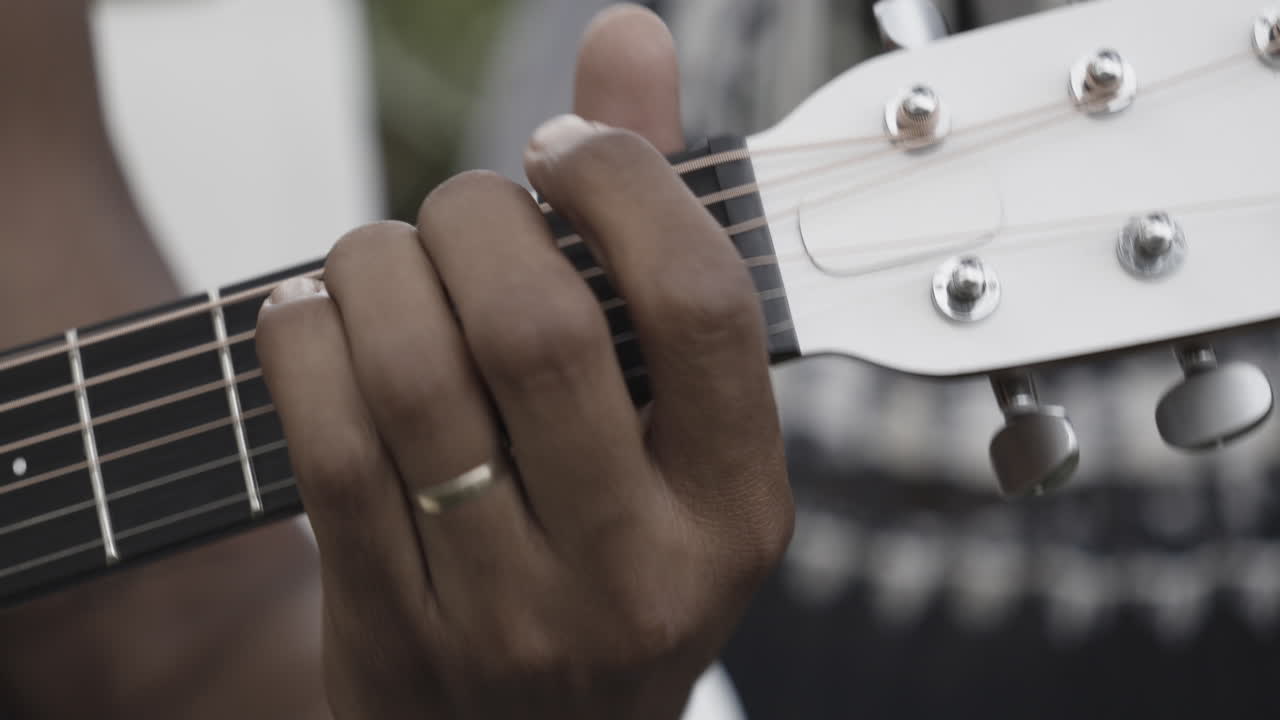 man playing guitar closeup