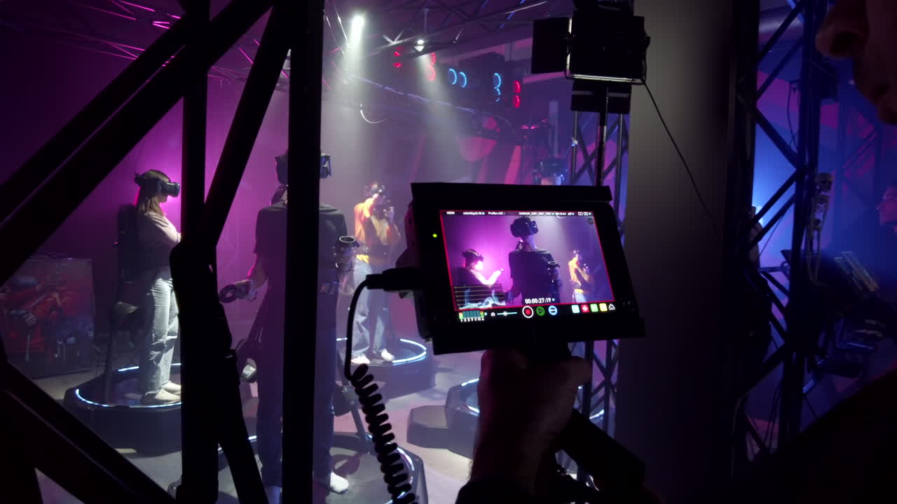 Camera filming a boy playing with a Virtual Reality headset