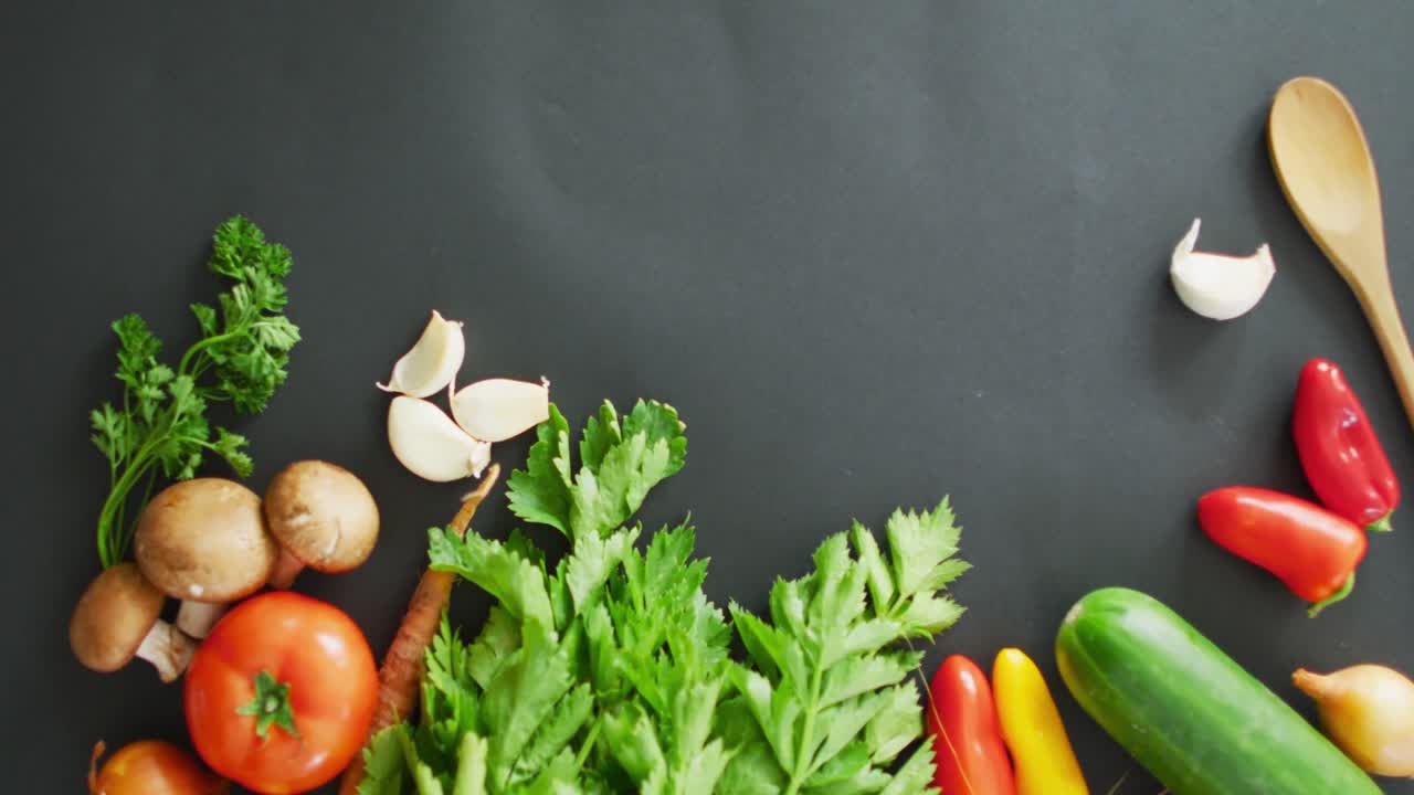 Video of fresh vegetables with copy space over grey background