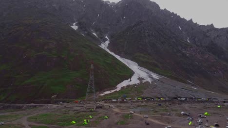 aerial pan up of snowy mountain with glacier near zojila pass, ladakh