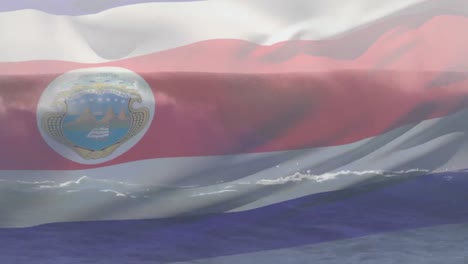 Digital-composition-of-waving-costa-rica-flag-against-waves-in-the-sea