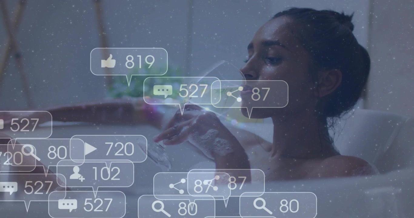 Woman reclining tub sipping glass while arm moving icons appearing over foam driving social metrics