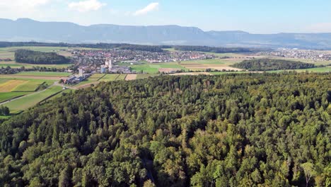 Drone-flight-with-a-DJI-drone-Bätterkinden-towards-Lohn-Ammannsegg-and-Biberist-towards-Solothurn-over-a-lot-of-green-nature-near-Bern-in-Switzerland