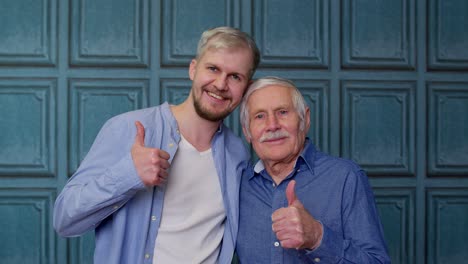 Happy-different-male-generations-family-of-senior-father-and-adult-son-or-grandson-showing-thumbs-up