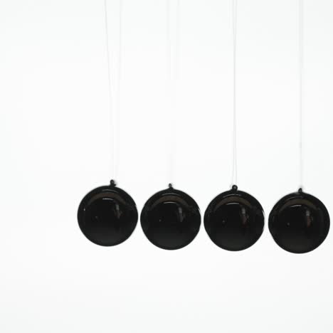 newton's cradle on a white background