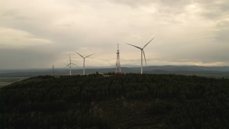 Windmill-in-countryside-against-cloudy-sky