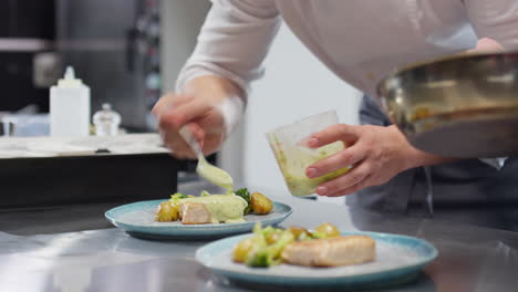 chef adding sauces to dishes