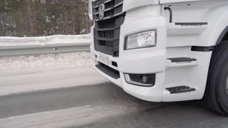 white semi-truck on a snowy road