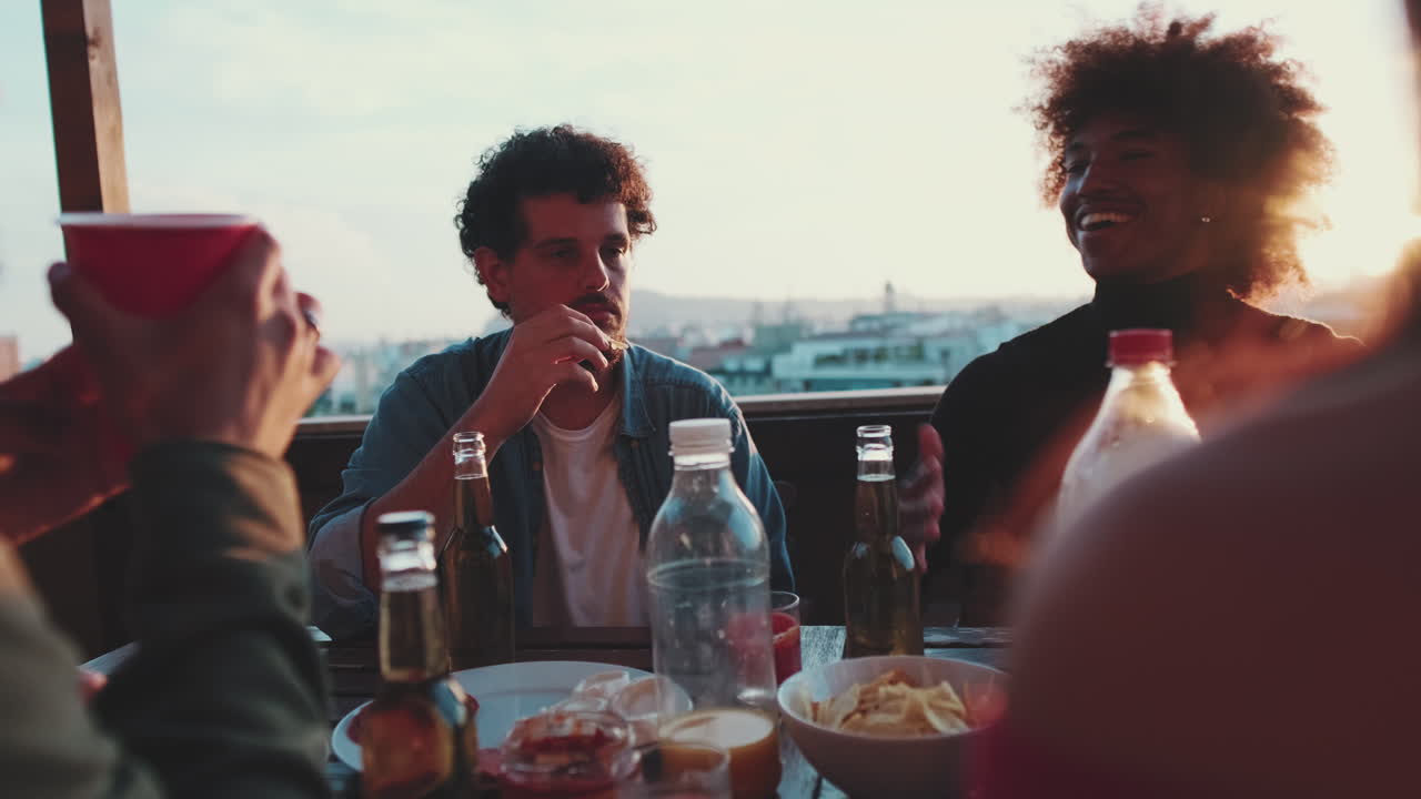 Friends Having a Rooftop Party at Sunset