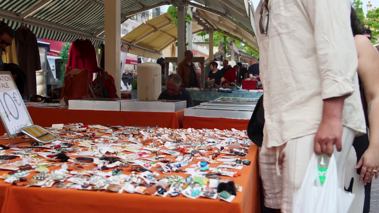 Bustling Outdoor Market Stall Selling Jewelry and Accessories