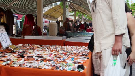 bustling outdoor market stall selling jewelry and accessories
