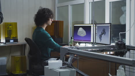 engineers working on 3d design and printing in a modern workshop