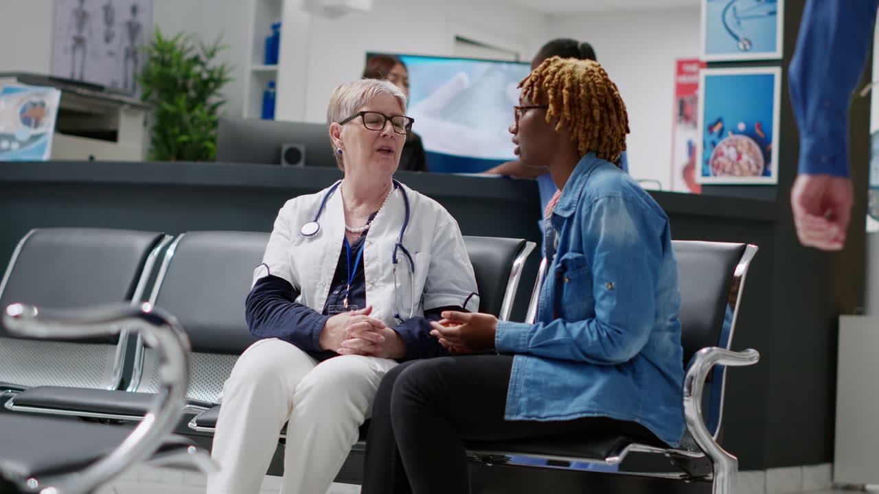 Doctor Consulting with Patient in Waiting Room
