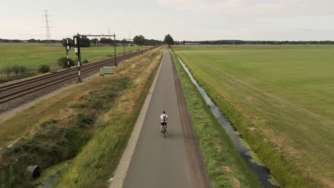 man cycling on a countryside path