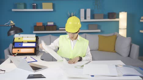 a funny and excited boy engineer turns his father's desk upside down.