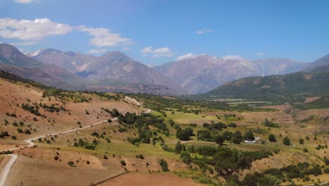 Beautiful-Scenery-Of-Countryside-Terrain-With-Road-Along-Mountainscapes-At-Summer-Near-Tashkent-City,-Uzbekistan