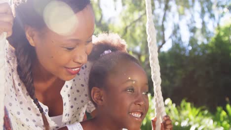 a mother and daughter laughing.