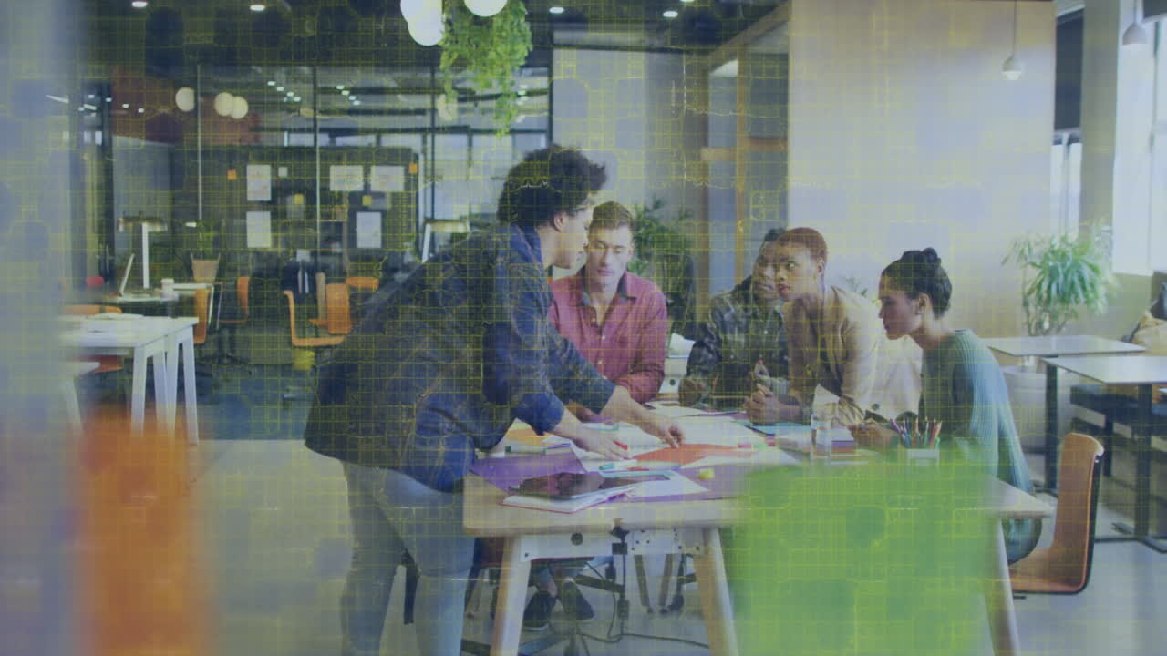Team collaborating at office table with digital data processing animation overlay