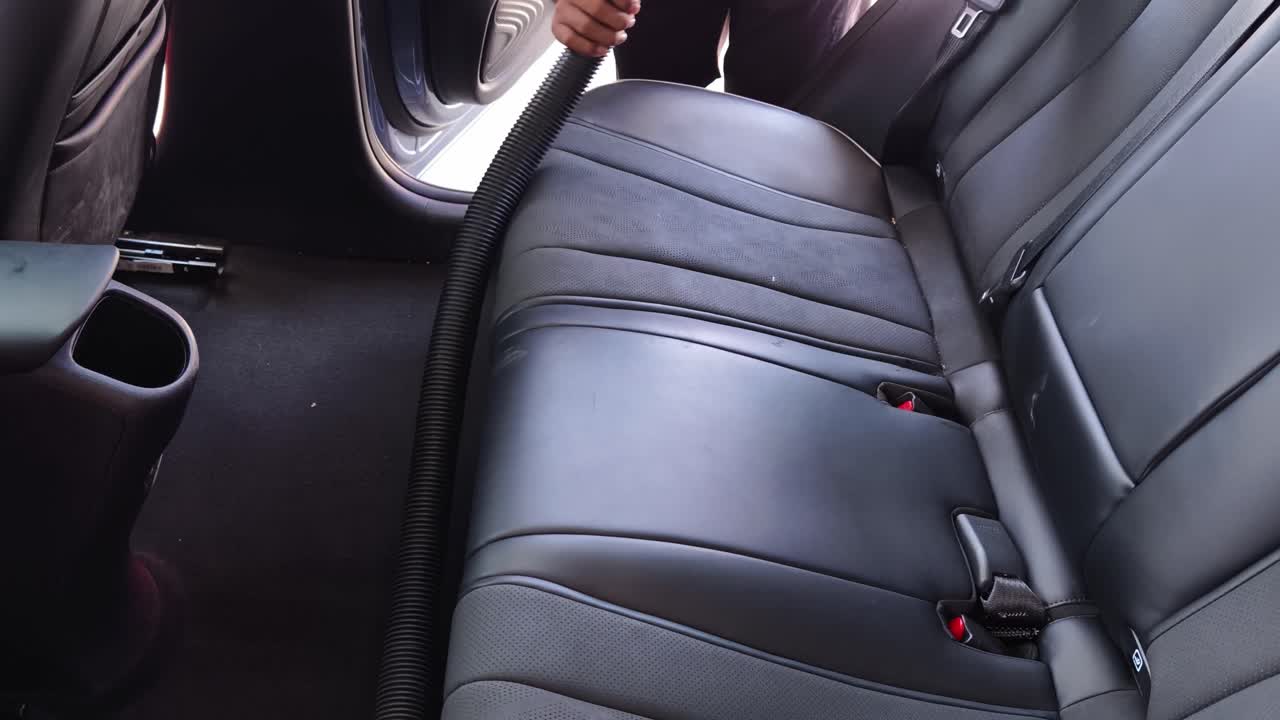 Vacuuming a Car Backseat