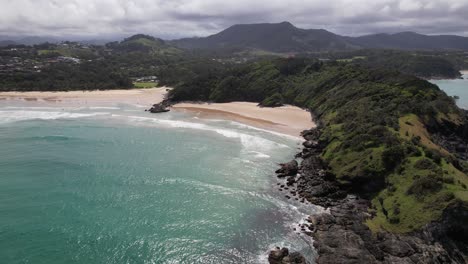 little diggers beach with turquoise seascape in nsw, australia - aerial shot