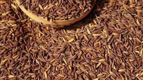 black-paddy-rice-seeds-in-bamboo-bowl-from-top-angle-at-day