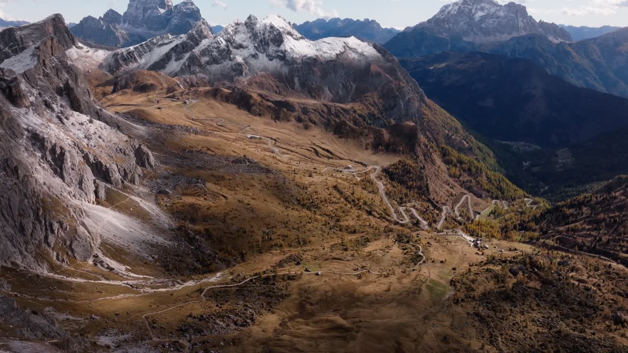 Aerial view as the seasons meet n the valley that the Falzarego pass winds through. Captured in peak autumn times during late October