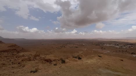 Ksar-Guermessa-troglodyte-village-in-Tunisia,-panning-panoramic-view