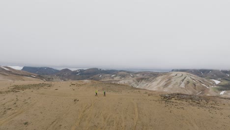 hikers continuing their trail, laugavegur mountain part 5, side view, iceland
