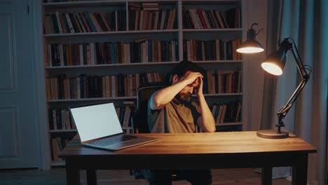 man tired working at home