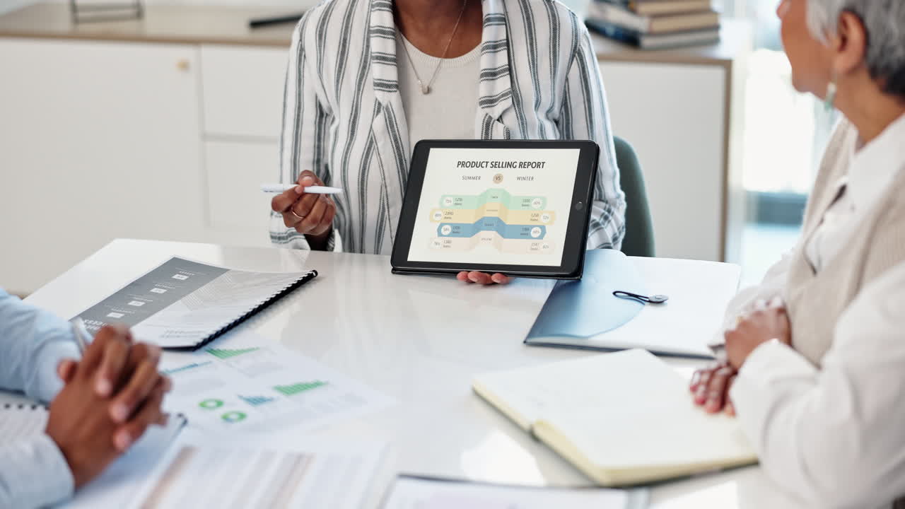 Business meeting with data presentation on tablet