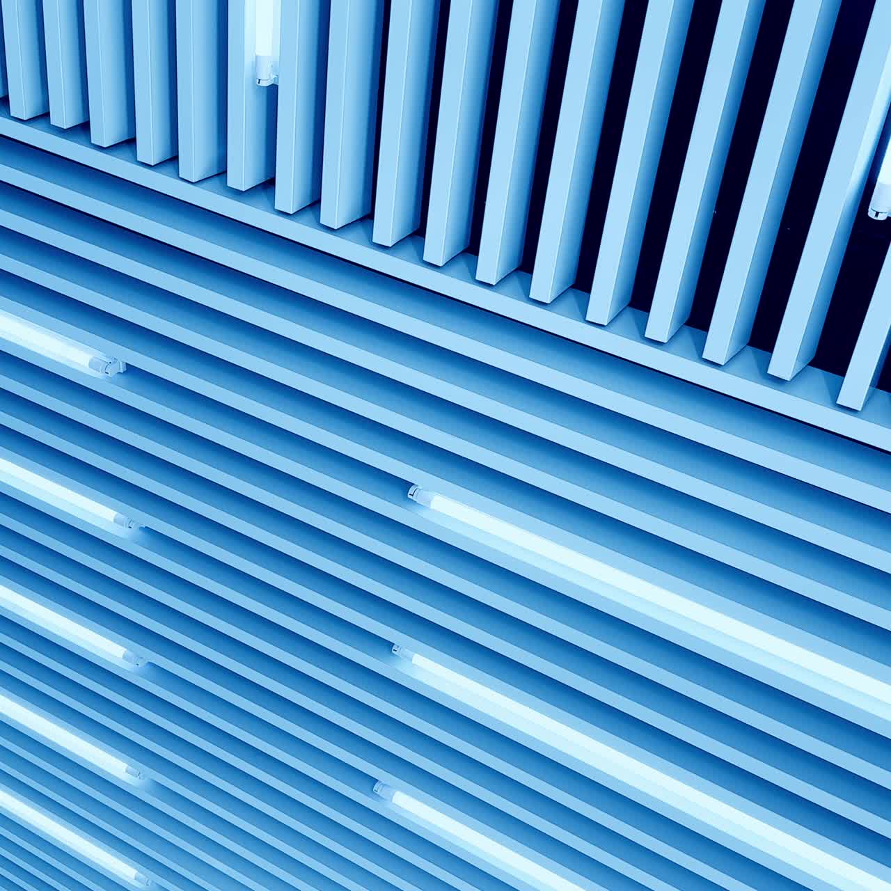 Bright illumination on the embossed plank ceiling. White light led lamps switched on. Low angle view