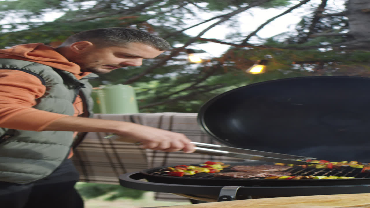 Food Blogger Cooking on Barbecue on Terrace