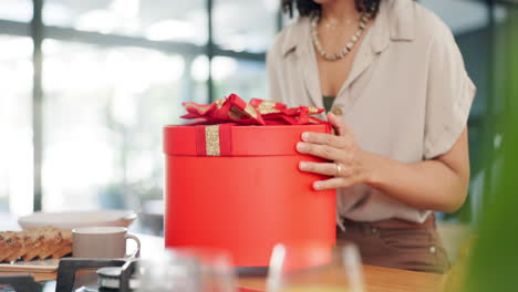 woman excitedly opening a gift