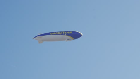 goodyear blimp in blue sky