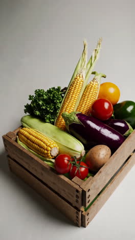 fresh vegetables in a wooden crate