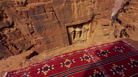 the treasury at petra, historic unesco heritage site carved into sandstone in jordan seen from a scenic viewpoint above and sideways. famous indiana jones hollywood movie filming location and tourist destination khaznet.