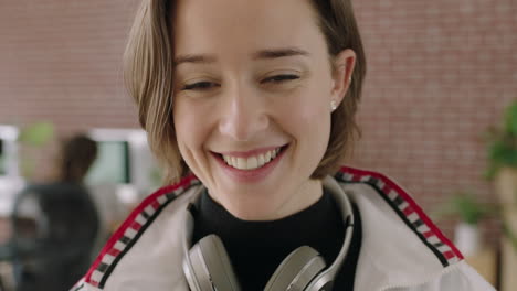 close-up-portrait-of-stylish-young-caucasian-woman-smiling-cheerful-independent-female-business-woman-in-contemporary-internet-cafe-workspace