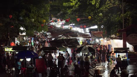 busy night market in hoi an, vietnam