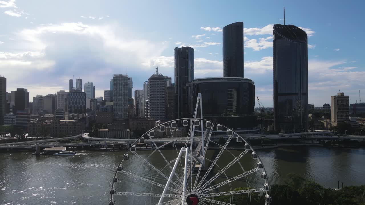 The Wheel of Brisbane observation wheel with views of the towering urban skyline of the Brisbane City CBD. Aerial view