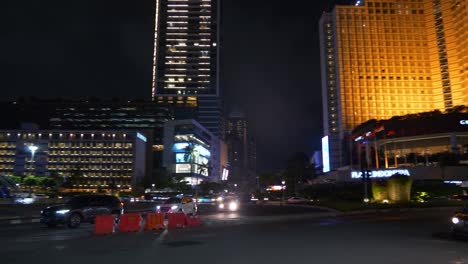 night illumination jakarta city downtown famous traffic street circle fountain panorama 4k indonesia